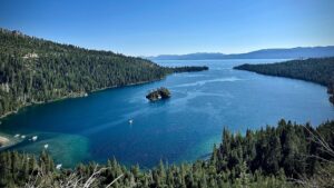 Lake Tahoe with the mountains and boats sailing in the lake.